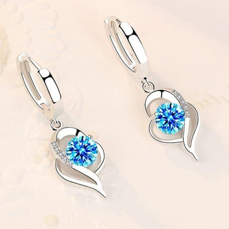 Oorbellen van zilver met ingelegde zirkonia bloemen | Witgoud