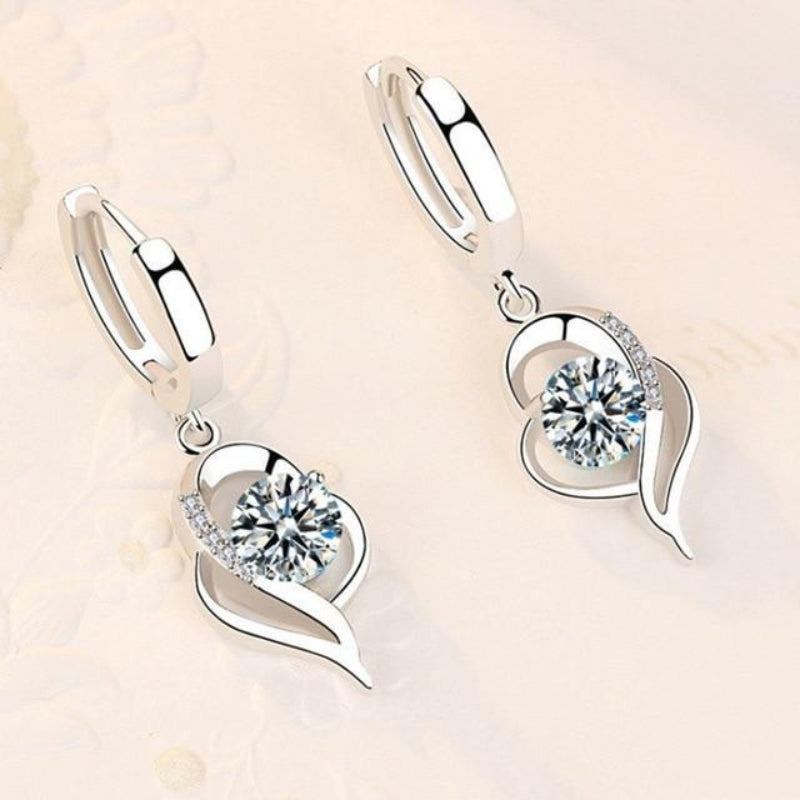 Oorbellen van zilver met ingelegde zirkonia bloemen | Witgoud