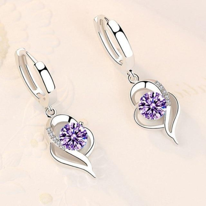 Oorbellen van zilver met ingelegde zirkonia bloemen | Witgoud